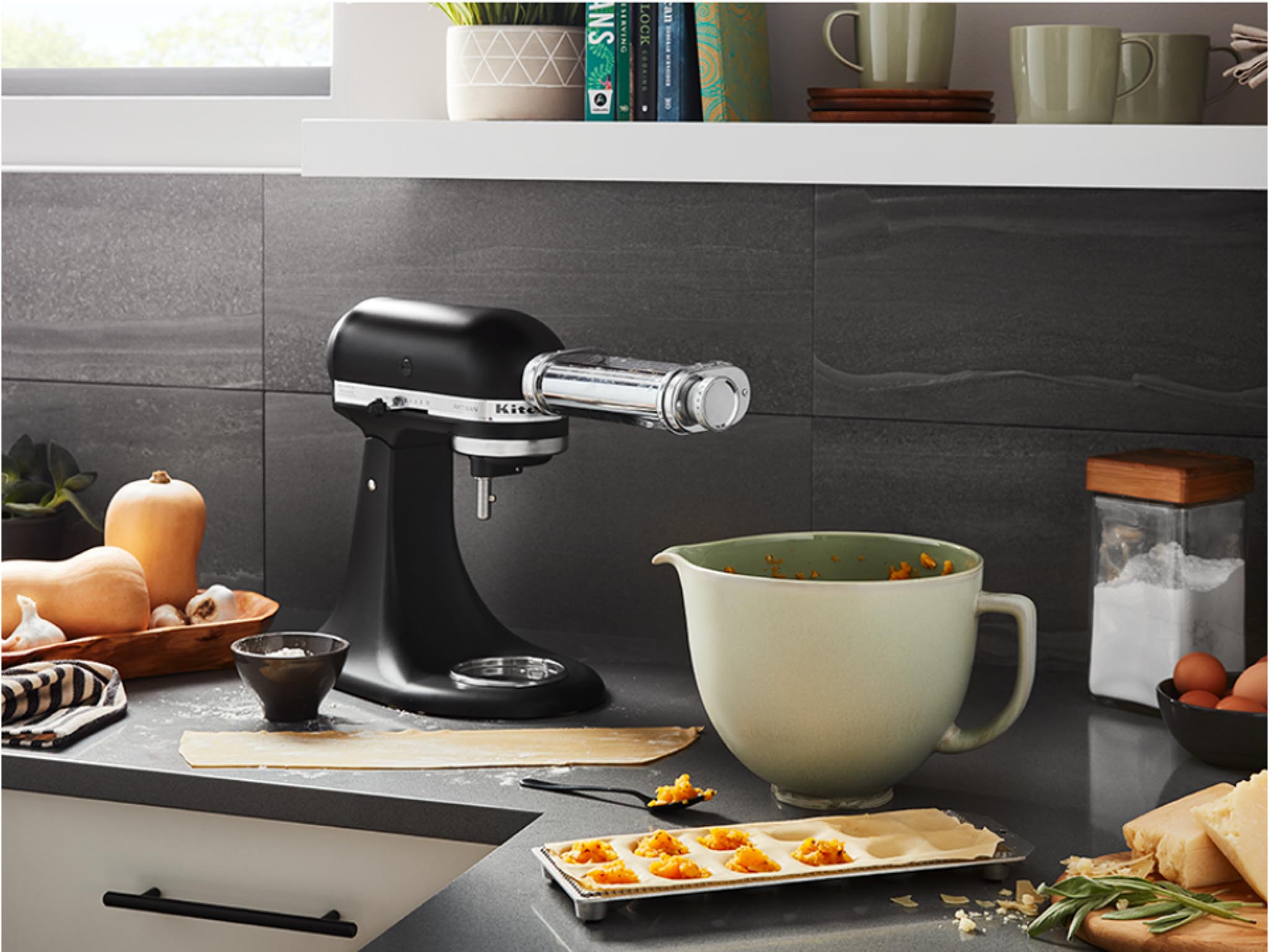 Accessories ceramic bowl sage leaf mixer and bowl on the kitchen table